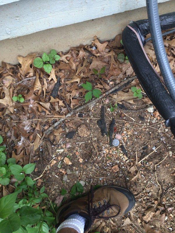 Responded to callback on recently installed Lennox EL18XCV-060-230B04 system (manufactured 11/2025, installed 12/2025) reporting error code 411 and low pressure switch activation on outdoor unit. Upon arrival, conducted visual inspection of outdoor unit and surrounding area. Verified unit accessibility and documented current condition of equipment and installation site. Unit appeared physically intact with no visible damage to exterior panels or components. Photographed manufacturer data plate showing model and serial number information, as well as installation area including refrigerant line set and electrical conduit routing along building foundation. System showed signs of proper installation with appropriate line set insulation and secure mounting on concrete pad. Area around unit contained natural debris accumulation including leaves and vegetation growth, though this did not appear to impact unit operation or airflow. Documented all findings with photographs for warranty claim pr