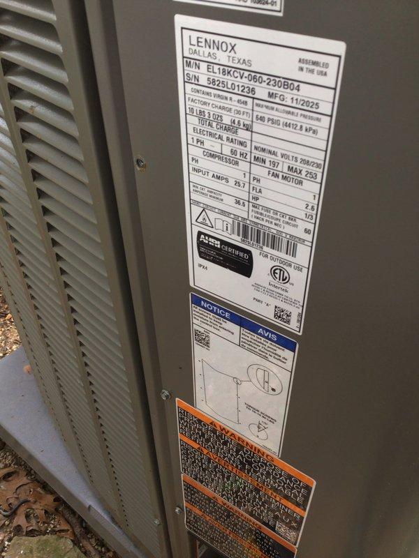 Responded to callback on recently installed Lennox EL18XCV-060-230B04 system (manufactured 11/2025, installed 12/2025) reporting error code 411 and low pressure switch activation on outdoor unit. Upon arrival, conducted visual inspection of outdoor unit and surrounding area. Verified unit accessibility and documented current condition of equipment and installation site. Unit appeared physically intact with no visible damage to exterior panels or components. Photographed manufacturer data plate showing model and serial number information, as well as installation area including refrigerant line set and electrical conduit routing along building foundation. System showed signs of proper installation with appropriate line set insulation and secure mounting on concrete pad. Area around unit contained natural debris accumulation including leaves and vegetation growth, though this did not appear to impact unit operation or airflow. Documented all findings with photographs for warranty claim pr