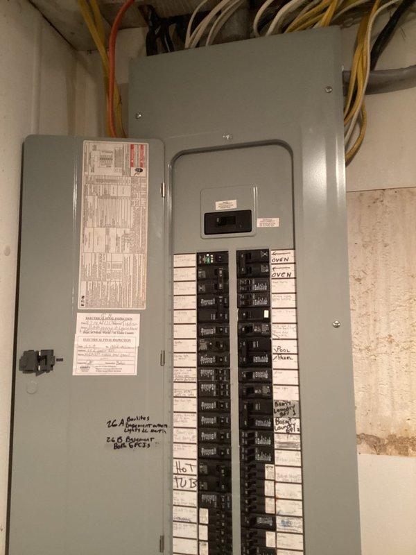 Completed comprehensive electrical safety inspection of residential service panel and distribution system. Documented existing electrical panel configuration, circuit breaker layout, and wire routing throughout the main distribution box. Inspected all visible electrical connections, verified proper circuit labeling including oven circuits, and assessed overall panel condition and wire management for code compliance and safety concerns.