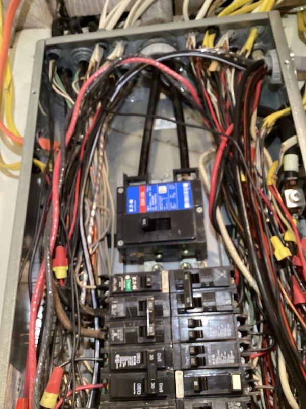 Completed comprehensive electrical safety inspection of residential service panel and distribution system. Documented existing electrical panel configuration, circuit breaker layout, and wire routing throughout the main distribution box. Inspected all visible electrical connections, verified proper circuit labeling including oven circuits, and assessed overall panel condition and wire management for code compliance and safety concerns.