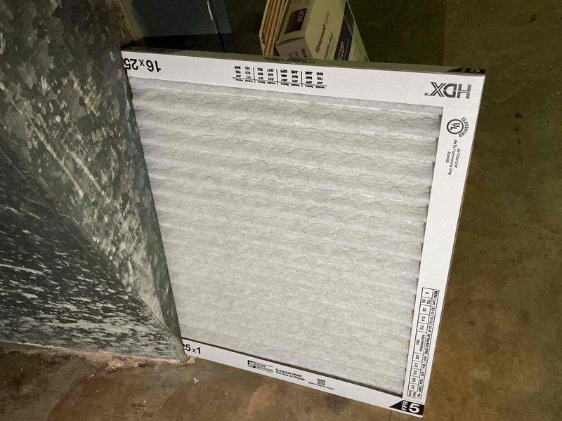 Completed preventive maintenance tune-up on a 7-year-old Goodman outdoor condensing unit, model F58091310. Inspected and replaced 16x25 HDX air filter, verified system operation with no accessories present, and documented equipment condition through photographic records showing both indoor filter replacement and outdoor unit inspection.