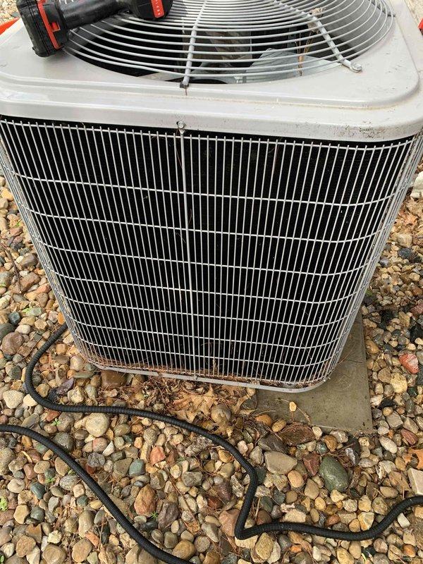 Completed comprehensive cooling system tune-up on outdoor AC condenser unit located at rear of property. Performed standard maintenance protocol including temperature differential measurements across the system, visual inspection of condenser coils and fan assembly, and verification of UV light system operation as requested. Unit found in operational condition with all components functioning within normal parameters.