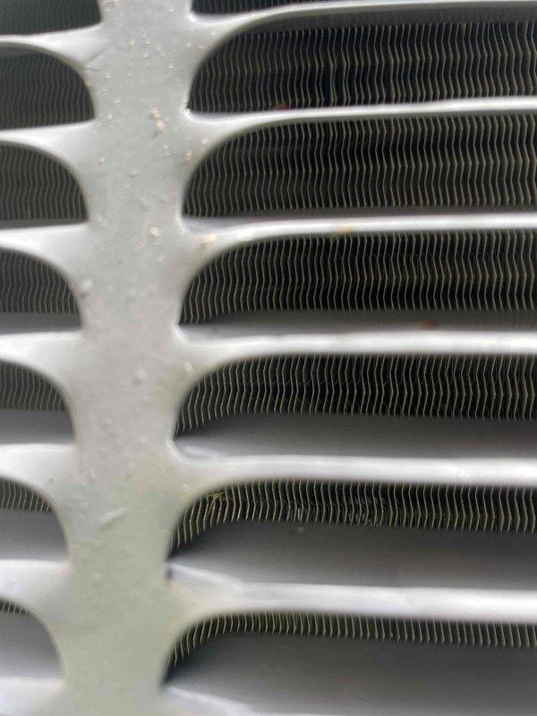 Responded to no cooling call on 9-year-old Rheem system. Found severely clogged air filter restricting airflow, causing system to fail to operate despite thermostat clicking normally after battery replacement. Removed and replaced dirty filter with new unit, restoring proper airflow to evaporator coil and heat exchanger. System tested and confirmed operational with adequate cooling performance restored.