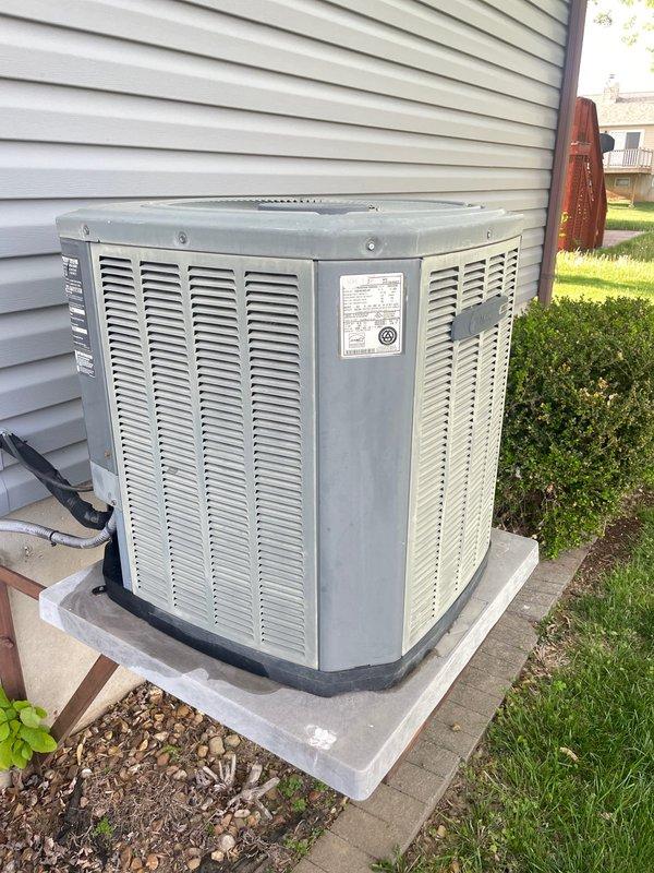 Responded to no cooling complaint on residential air conditioning system over 10 years old. Upon arrival, verified thermostat settings and found unit calling for cooling with indoor temperature at 79°F and setpoint at 74°F. Inspected outdoor condenser unit and identified system malfunction preventing proper operation. Diagnosed issue, performed necessary repairs to restore cooling function, and confirmed system operating properly before departure.