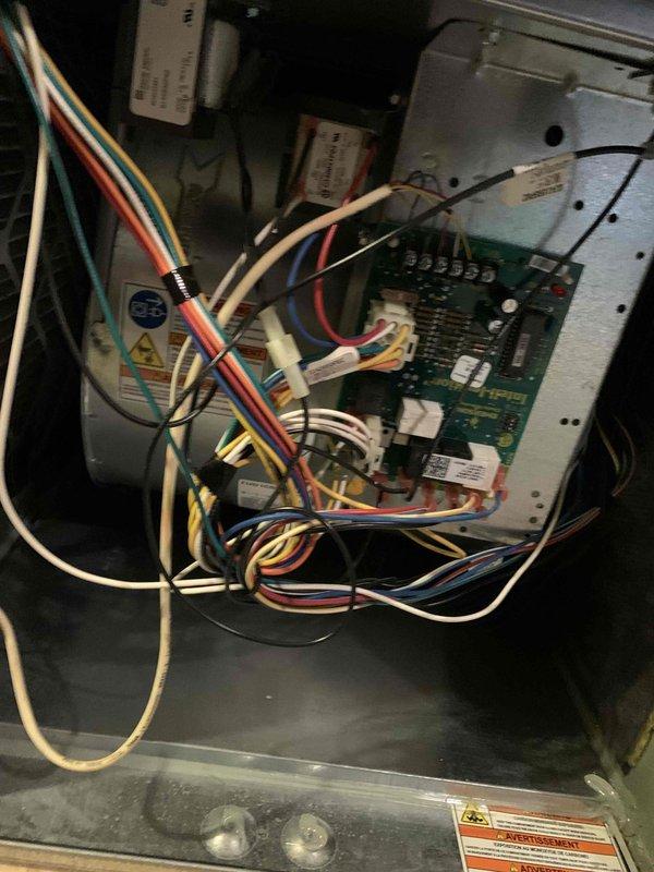 Completed comprehensive cooling system tune-up on residential HVAC unit located at side of house (under 10 years old). Performed full system inspection including examination of control board, electrical connections, and capacitors. Inspected and documented condition of air filter, which showed moderate dust accumulation and discoloration requiring attention. All electrical components, wiring connections, and control board functioning properly with no issues identified during service.