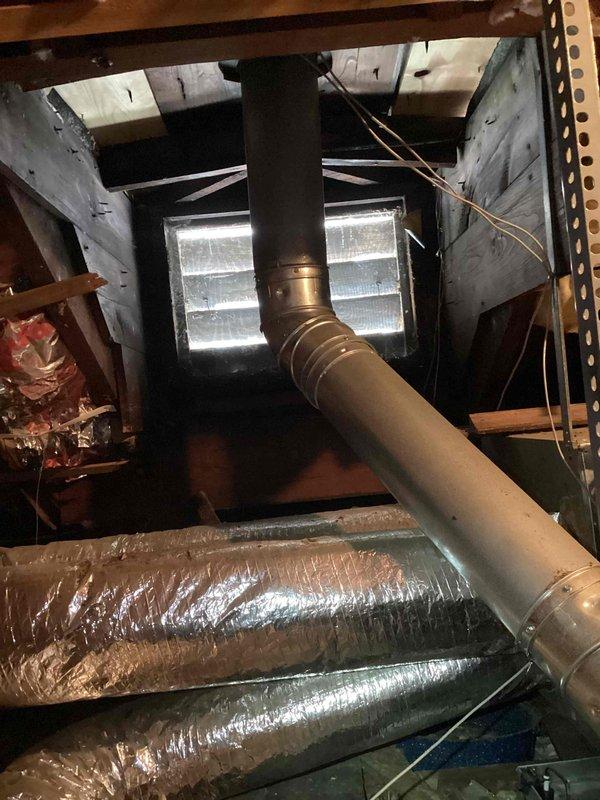 Responded to no-cool complaint and found clogged condensate drain line on attic-located Lennox air conditioning unit causing water overflow and resulting ceiling stains. Cleared drain line obstruction, verified proper drainage flow, and tested system operation to confirm cooling function restored. Downstairs unit inspected and found operating normally with no issues detected.