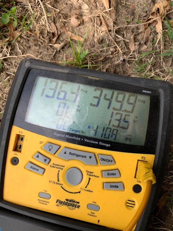 Responded to no cooling complaint on residential HVAC system. Upon arrival, verified thermostat calling for cooling with display reading 81°F. Proceeded to outdoor unit located at ground level to diagnose issue. Connected Fieldpiece digital manifold gauges to service ports and recorded system pressures. High side pressure reading showed 349.9 PSIG with ambient temperature at 135°F, indicating significantly elevated head pressure. Low side pressure measured at 100 PSIG, well above normal operating range for cooling mode.

Diagnosis revealed system was severely overcharged with refrigerant, preventing proper heat exchange and cooling capacity. Recovered excess refrigerant from system to bring pressures within manufacturer specifications. Monitored pressures during recovery process until achieving proper operating parameters. Verified compressor amperage draw returned to normal range after refrigerant adjustment.

Cycled system through multiple cooling cycles to confirm proper operation. 