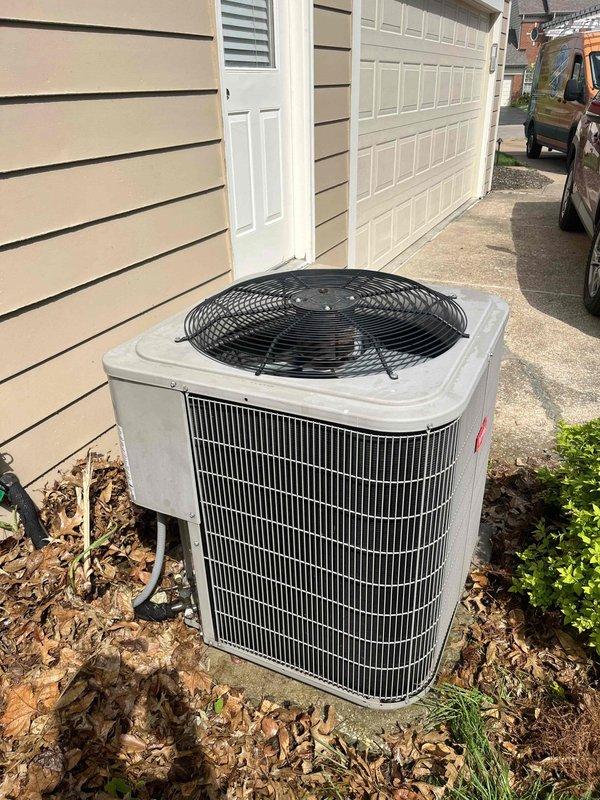 Completed preventive maintenance tune-up on 8-year-old residential split-system air conditioning unit located on exterior side of home. Performed comprehensive cooling system inspection including condenser unit evaluation, refrigerant level check, electrical connection testing, and thermostat functionality verification. System operating properly with Nest thermostat displaying 69°F in cooling mode and outdoor condenser unit showing normal operation with clean airflow through heat exchanger coils.