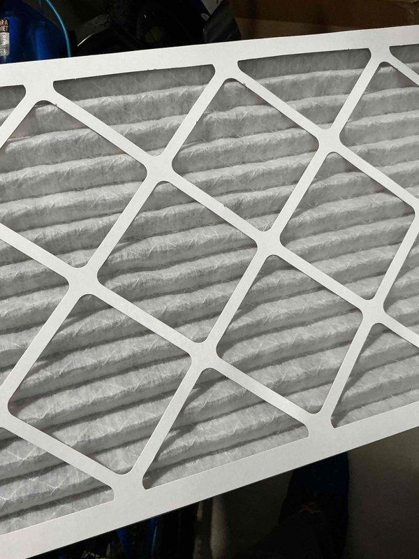 Completed cooling season tune-up on 5-year-old ground-level AC unit located in basement. Performed comprehensive system inspection including electrical connections, refrigerant levels, and airflow verification. Replaced air filter with new pleated media filter and documented equipment condition with photos of blower assembly and control board.