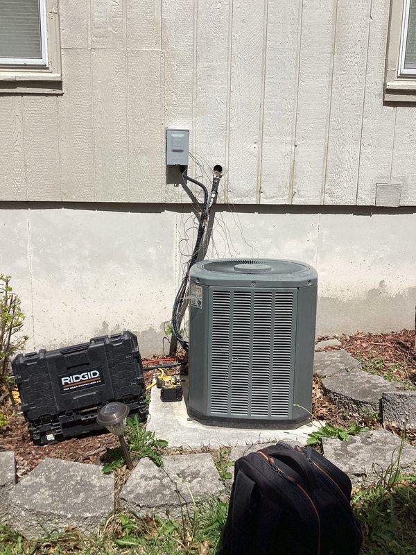 Responded to no cooling call on 10+ year old FSM4P2400A unit located in side yard. Upon arrival, found outdoor condenser would not power on. Performed diagnostic evaluation and documented unit specifications showing February 2012 manufacture date with R-410A refrigerant system. Inspected electrical connections, conduit, and disconnect box mounted on exterior wall. Identified issue preventing system operation and restored cooling functionality to unit.