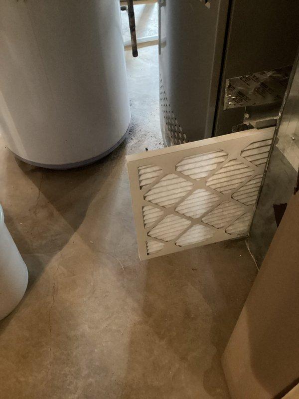 Completed comprehensive U10 cooling tune-up on 3-year-old ground-level HVAC system. Performed full system inspection, replaced air filter, verified refrigerant levels, tested electrical components, and confirmed proper airflow through ductwork. Collected PMA renewal payment and documented system condition with photos showing equipment location in basement utility area and exposed ductwork installation.