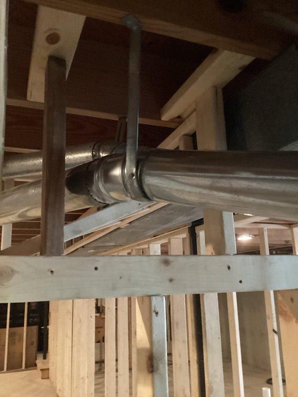 Completed comprehensive U10 cooling tune-up on 3-year-old ground-level HVAC system. Performed full system inspection, replaced air filter, verified refrigerant levels, tested electrical components, and confirmed proper airflow through ductwork. Collected PMA renewal payment and documented system condition with photos showing equipment location in basement utility area and exposed ductwork installation.