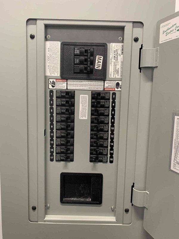 Conducted electrical estimate for commercial ceiling fan installations on second and third floors. Assessed existing electrical infrastructure including main distribution panel with 20-circuit capacity and verified adequate breaker availability for new fixture loads. Evaluated ceiling mounting conditions with exposed corrugated metal decking and existing electrical routing pathways. Documented current wiring configuration and mounting hardware requirements for fan installations. Customer to provide fan fixtures for subsequent installation scheduling.