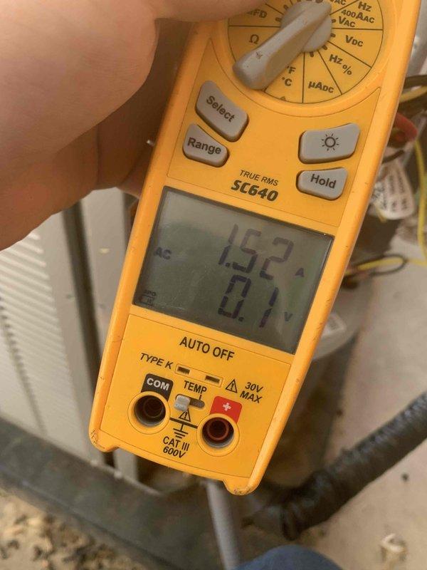 Returned to property to confirm location of refrigerant leak as previously identified during maintenance visit. Performed diagnostic testing using digital multimeter to check electrical readings and system performance. Measured amperage draw at 1.52A and voltage readings, then conducted follow-up measurements showing 5.91A draw to verify compressor and system operation. Confirmed leak location and documented findings for repair quote preparation.