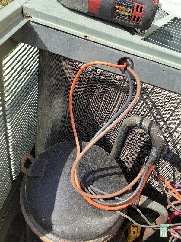 Completed comprehensive tune-up service on single outdoor condensing unit for Home Depot maintenance agreement. Performed system inspection revealing moderate dust and debris accumulation on condenser coil fins; verified all electrical connections, capacitor function, and refrigerant line integrity. Documented airflow direction at indoor air handler, confirmed proper installation of filtration media, and captured equipment condition photos showing unit operational with minor cosmetic weathering consistent with outdoor exposure.