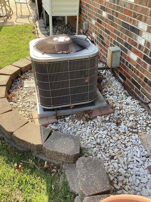 Responded to reported water leak from furnace in basement with rust present and wet filter condition. Performed diagnostic inspection of HVAC system including basement furnace unit and outdoor condenser. AC unit confirmed to be cooling properly at time of service, with outdoor condenser operating normally and positioned on concrete pad with adequate clearance. Documented existing thermostat configuration and system controls for service records.