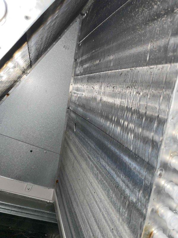 Performed evaporator coil cleaning service on HVAC air handling unit. After consulting with customer regarding service level options, completed Level 1 coil cleaning to remove accumulated dust and debris from the finned heat exchanger surfaces. System coil now cleaned and operational.
