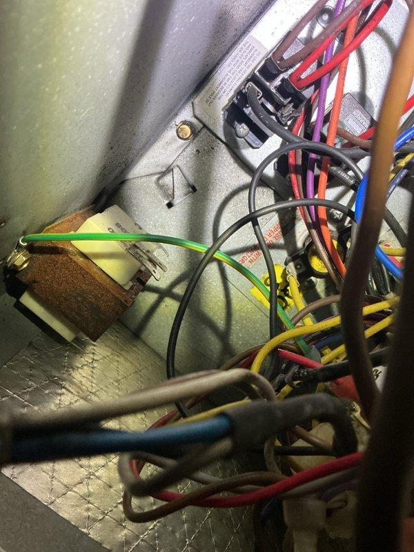 Responded to service call for indoor unit freezing and inadequate cooling on 10+ year old system. Upon inspection, found compromised electrical connections and wiring issues within the air handler that were impacting proper system operation. Performed electrical diagnostics, secured loose wire connections at terminal blocks, and verified all electrical components including capacitor were functioning within specifications.