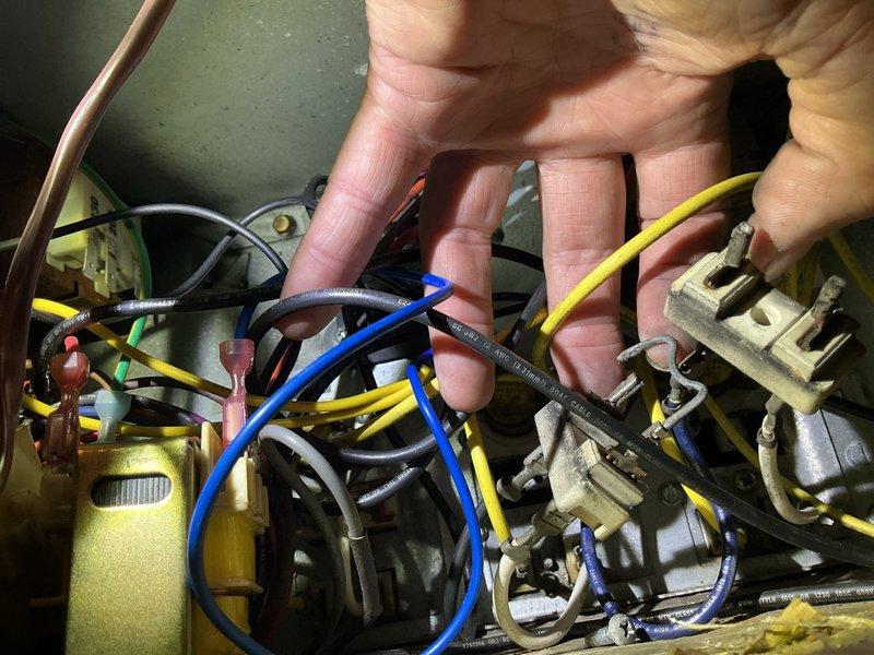Responded to service call for indoor unit freezing and inadequate cooling on 10+ year old system. Upon inspection, found compromised electrical connections and wiring issues within the air handler that were impacting proper system operation. Performed electrical diagnostics, secured loose wire connections at terminal blocks, and verified all electrical components including capacitor were functioning within specifications.