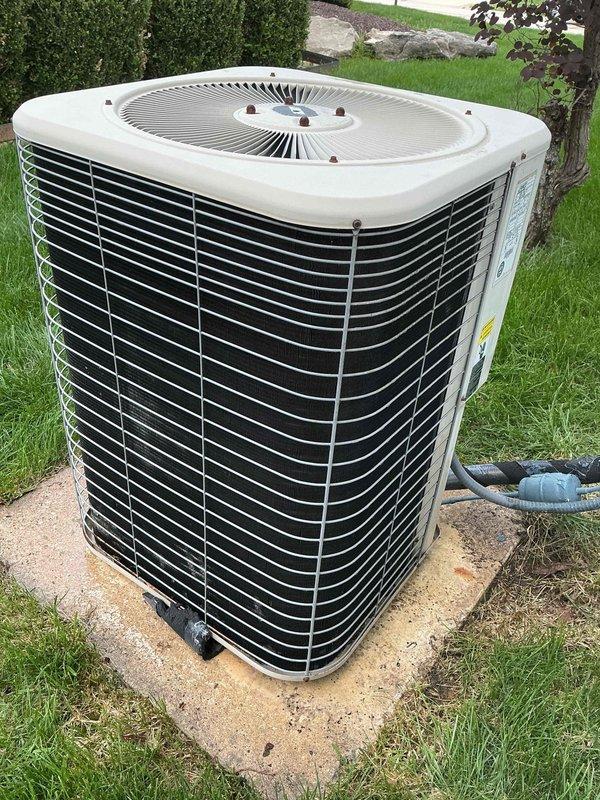 Completed comprehensive air conditioning tune-up and maintenance on single outdoor condensing unit located on side of residence. Performed visual inspection of all accessible components including capacitor, electrical connections, and condenser coil; verified all wiring connections were secure with proper bundling; inspected condensate drain assembly for proper operation; examined condenser coil fins for debris and damage; confirmed unit mounted securely on concrete pad with adequate clearance. System found in good operating condition with all components functioning properly and no immediate service needs identified.