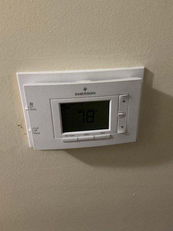 Completed comprehensive cooling tune-up on 3-year-old ground-level outdoor condensing unit located at side of residence. Performed standard preventive maintenance protocol including inspection of blower motor assembly, control board connections, and electrical components within air handler cabinet. Verified thermostat operation and temperature settings at 78°F on Emerson programmable unit, confirmed proper system response and mode functionality for cooling season readiness.