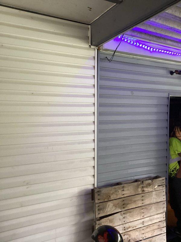 # Electrical Maintenance - Home Audit

Conducted a complimentary electrical safety inspection of residential premises, examining outlet conditions, wiring connections, and LED lighting installations. Documented kitchen backsplash outlet with illuminated indicator light and power cord connections, as well as garage LED strip lighting installation with visible wiring along wall-ceiling junction. All observed electrical components were photographed for record-keeping purposes.