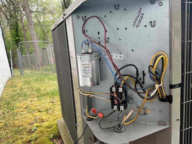 Responded to callback for non-functioning Nest thermostat issue following previous service appointment. Inspected outdoor unit electrical compartment and verified all connections at contactor, capacitor (TITAN PRO TRCFD455, 45+5MFD 440/370VAC), and associated wiring. All electrical components tested within normal operating parameters, connections secure, and unit operational at time of departure.