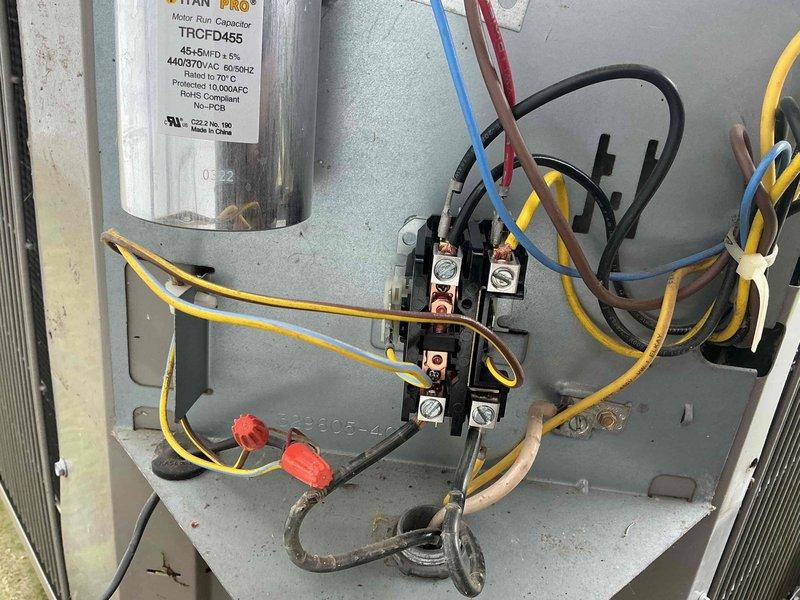 Responded to callback for non-functioning Nest thermostat issue following previous service appointment. Inspected outdoor unit electrical compartment and verified all connections at contactor, capacitor (TITAN PRO TRCFD455, 45+5MFD 440/370VAC), and associated wiring. All electrical components tested within normal operating parameters, connections secure, and unit operational at time of departure.