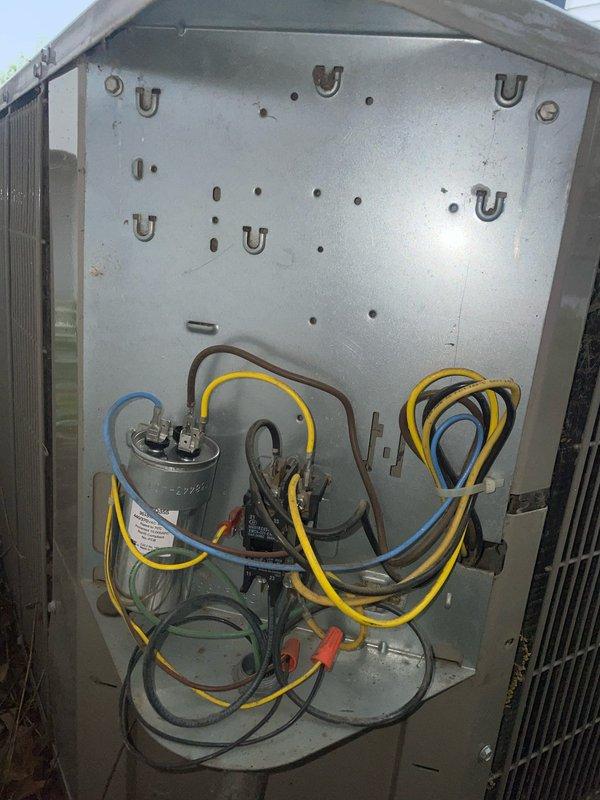 Responded to no cooling complaint on 10-year-old AC system with outdoor unit motor failure. Upon inspection, diagnosed failed run capacitor preventing condenser fan motor from starting. Replaced defective dual run capacitor with OEM-spec component, verified proper microfarad ratings, and secured all electrical connections. Tested system operation, confirmed condenser fan motor engagement, and verified unit returned to normal cooling cycle with proper amperage draw.