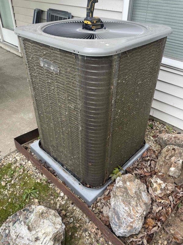 Performed comprehensive cooling season tune-up on a one-year-old residential air conditioning system. Conducted full system inspection including outdoor condenser unit and indoor air handler components, verified proper blower motor operation, inspected electrical connections and wiring harnesses, checked capacitor function, and cleaned condenser coil. All components found operating within normal parameters with system performing efficiently for continued cooling season operation.