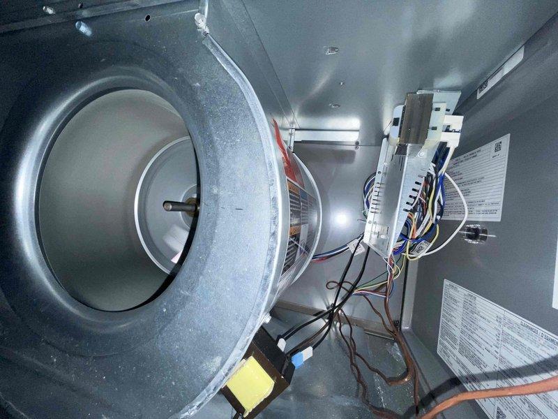 Performed comprehensive cooling season tune-up on a one-year-old residential air conditioning system. Conducted full system inspection including outdoor condenser unit and indoor air handler components, verified proper blower motor operation, inspected electrical connections and wiring harnesses, checked capacitor function, and cleaned condenser coil. All components found operating within normal parameters with system performing efficiently for continued cooling season operation.