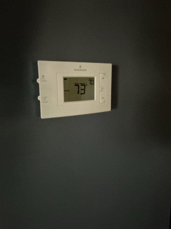 Replaced drain trap assembly on HVAC system and performed preventative maintenance safety check (PSCC). Verified thermostat operation showing proper temperature readings and inspected air filtration system with pleated filter in place. All components tested and confirmed operational for both heating and cooling modes.