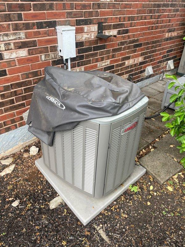 Responded to no-cool call on Lennox outdoor condensing unit in backyard. Customer reported unit not activating when called by thermostat. Upon inspection, found unit with loose cover and accessed electrical panel. Verified capacitor condition and checked contactor operation. Inspected all wire connections including control wiring (yellow, red, orange, purple, white) and power supply. Tested unit operation and confirmed proper startup sequence. System now responding correctly to thermostat calls.