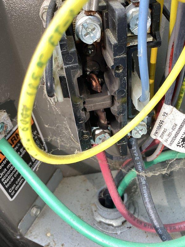 Responded to service call for intermittent operation of 6-year-old heating and cooling system. Upon inspection, discovered oxidized and corroded electrical connections at the contactor assembly in the outdoor unit, along with accumulated debris and deteriorated components in the equipment chase area. Cleaned electrical terminals, verified proper wire connections at terminal blocks, and assessed overall system condition to address the intermittent power issue affecting both heating and cooling functions.