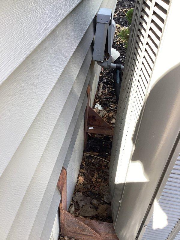 Responded to service call for intermittent operation of 6-year-old heating and cooling system. Upon inspection, discovered oxidized and corroded electrical connections at the contactor assembly in the outdoor unit, along with accumulated debris and deteriorated components in the equipment chase area. Cleaned electrical terminals, verified proper wire connections at terminal blocks, and assessed overall system condition to address the intermittent power issue affecting both heating and cooling functions.