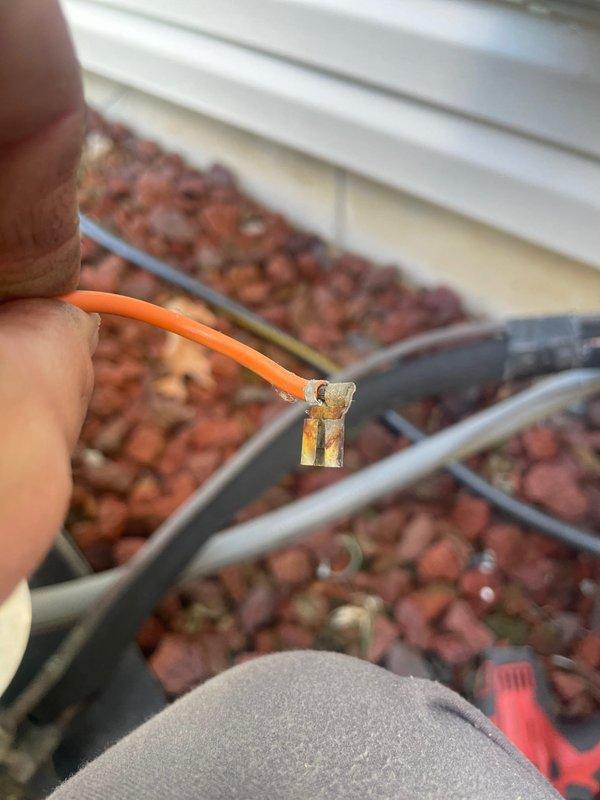 Responded to service call for AC unit that would not shut off. Diagnosed faulty capacitor on outdoor condensing unit showing signs of terminal corrosion and deterioration. Replaced defective capacitor and disconnected orange thermostat wire. Tested system operation and verified unit now cycles properly on and off as commanded by thermostat. System restored to normal operation.