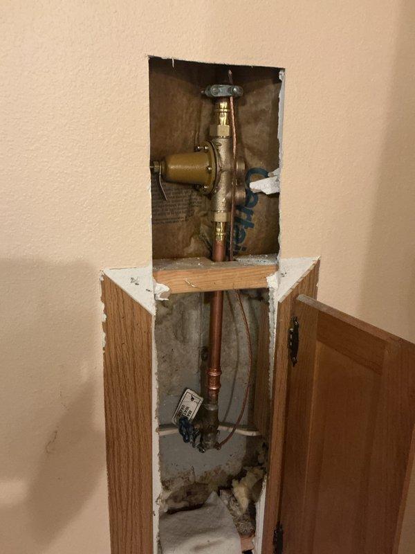 Installed a 50-gallon tall electric water heater in basement utility area with 3/4-inch pressure reducing valve. Connected copper supply lines with brass fittings to existing plumbing infrastructure and verified proper operation of all components. Payment collected cash on delivery.