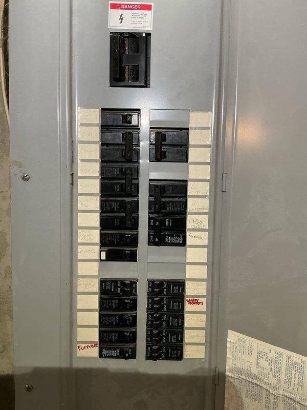 Responded to no power condition affecting garage area. Located electrical panel in basement and performed visual inspection of circuit breakers and panel components. Identified tripped breaker serving garage circuit. Reset affected breaker and verified power restoration to garage area. Confirmed all circuit breakers properly seated and panel operating within normal parameters.