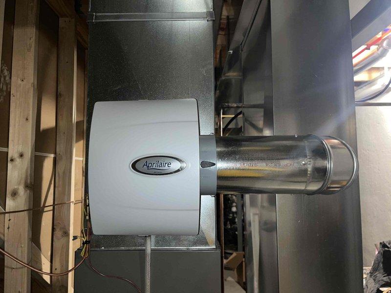 Responded to service call for 9-year-old air conditioning system experiencing excessive noise and inadequate cooling performance. Upon inspection, noted air filter had become heavily soiled within 3-4 weeks of replacement, indicating potential airflow restriction or indoor air quality issues. Evaluated Lennox furnace and air handler assembly, inspected ductwork connections and Aprilaire humidifier integration for proper operation. Diagnosed cooling system malfunction, addressed noise concerns, and restored unit to proper working condition. Recommended monitoring filter condition more frequently to identify source of accelerated contamination.