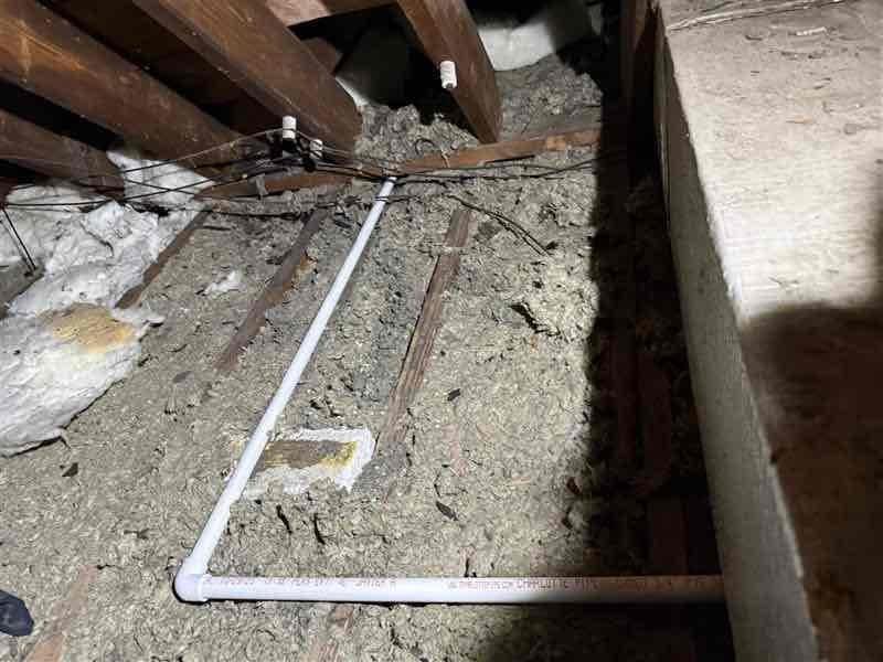 Responded to callback for evaporator coil leak repair on R22 system. Upon arrival, accessed attic-mounted air handler and located U-shaped copper refrigerant line exhibiting significant discoloration and oxidation indicative of leak point. Attempted leak repair per service manager authorization, however, extensive corrosion observed on lower heat exchanger section with heavy rust buildup on fins suggested systemic deterioration. Applied leak sealant to affected copper piping connections and monitored for stability. Recharged system with R22 refrigerant to manufacturer specifications. Documented existing conditions including corroded evaporator coil sections and compromised heat exchanger fins through photographic evidence for customer records and future service reference.