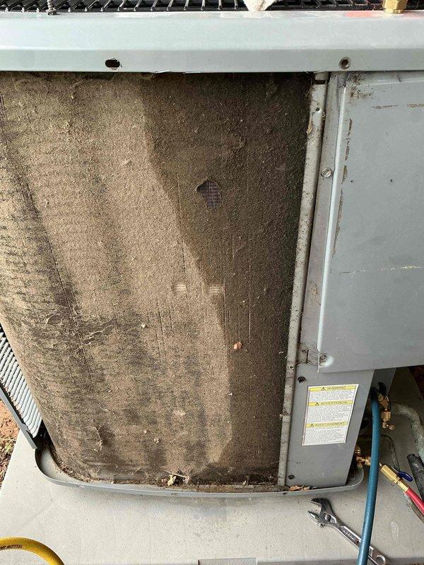 Responded to no cool call on 10+ year old Daikin system. Upon arrival, found heavily clogged air filter restricting airflow to indoor unit, with significant accumulation of dust and debris throughout filter media. Removed and replaced dirty filter with clean unit. System tested and confirmed operational with proper cooling output restored.
