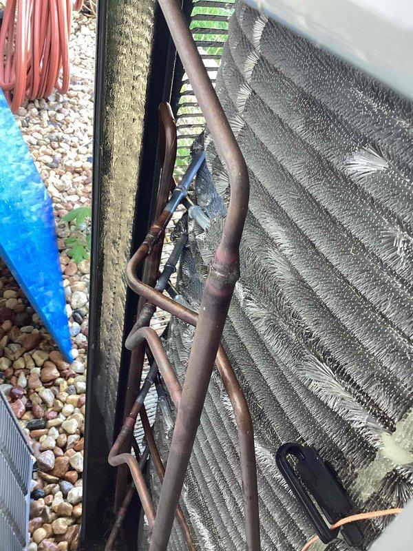 Completed routine cooling system tune-up and maintenance on dual HVAC systems (3-year-old Emerson and 3-year-old Trane units). Performed comprehensive inspection of both outdoor condensing units, including cleaning of evaporator coils which showed moderate accumulation of dirt, dust, and environmental debris between aluminum fins. Verified refrigerant line connections and inspected copper linesets for proper insulation and signs of wear. Checked electrical connections and tested system operations. Inspected indoor air return grilles and verified proper airflow throughout the system. Both units operational and ready for cooling season.