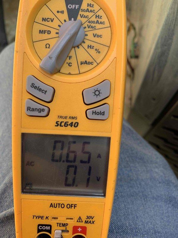 Completed comprehensive tune-up on 10-year-old outdoor air conditioning unit during scheduled morning service window. Performed full system inspection including condenser fan motor assembly, verified electrical performance using digital multimeter with readings of 0.65A current draw and proper voltage levels. All components operating within manufacturer specifications and system ready for continued service.