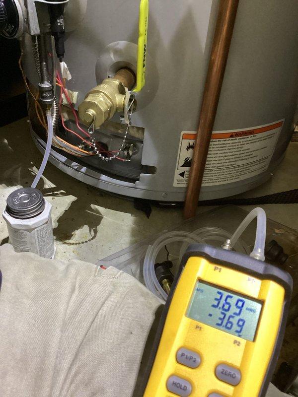 Responded to callback for pilot light issues on recently installed water heater. Upon arrival, performed comprehensive diagnostic testing of gas supply system using digital manometer. Measured gas pressure at multiple points including inlet and manifold pressure to verify proper gas flow to pilot assembly. Initial reading showed 36.9 units at supply line, with manifold pressure measuring 5.96 inches water column. Inspected gas valve assembly, pilot generator, and thermocouple connections for proper installation and functionality. Verified all brass fittings were secure and flexible gas line connections were properly tightened to manufacturer specifications. Checked pressure relief valve installation and copper piping connections at top of tank. Examined pilot assembly components including igniter electrode gap and flame sensor positioning. Adjusted gas pressure regulator to ensure optimal performance within manufacturer's specified range. Tested pilot ignition sequence multiple times t