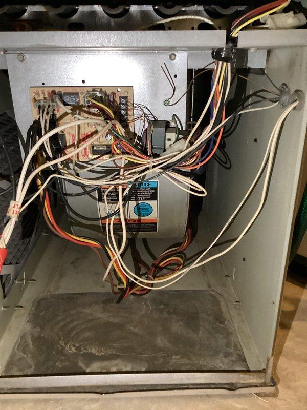 Completed comprehensive AC tune-up on 3-year-old residential unit located at rear exterior of property for new customer under Home Depot service agreement #F58795910AC. Upon inspection, discovered evaporator coil with heavy accumulation of dirt, dust, and debris significantly restricting airflow and reducing system efficiency. Performed thorough coil cleaning to restore proper heat transfer capabilities. Inspected indoor air handler control board and verified all electrical connections secure despite somewhat disorganized wiring configuration. Checked refrigerant lines, condensate drainage system, and all mechanical components for proper operation. Unit returned to normal operating parameters following maintenance procedures.