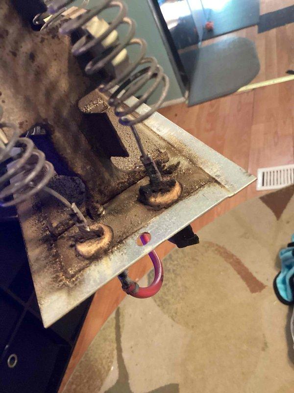 Responded to service call for smoke coming from heating and cooling system in mobile home. Upon arrival, found 17-year-old furnace with evaporator coil severely compromised by extensive dirt accumulation, corrosion, and debris buildup. Inspection revealed heavy contamination throughout the coil assembly and surrounding cabinet, with visible deterioration of copper tubing and metal housing components. The excessive buildup was determined to be the source of the smoke condition when the system attempted to operate. Due to the advanced age of the unit, extent of corrosion, and safety concerns associated with the compromised coil condition, recommended system replacement rather than repair. Documented equipment condition with photos showing the severity of contamination and component deterioration. Advised customer that the 3-year-old air conditioning system could potentially be salvaged depending on compatibility with replacement heating equipment.