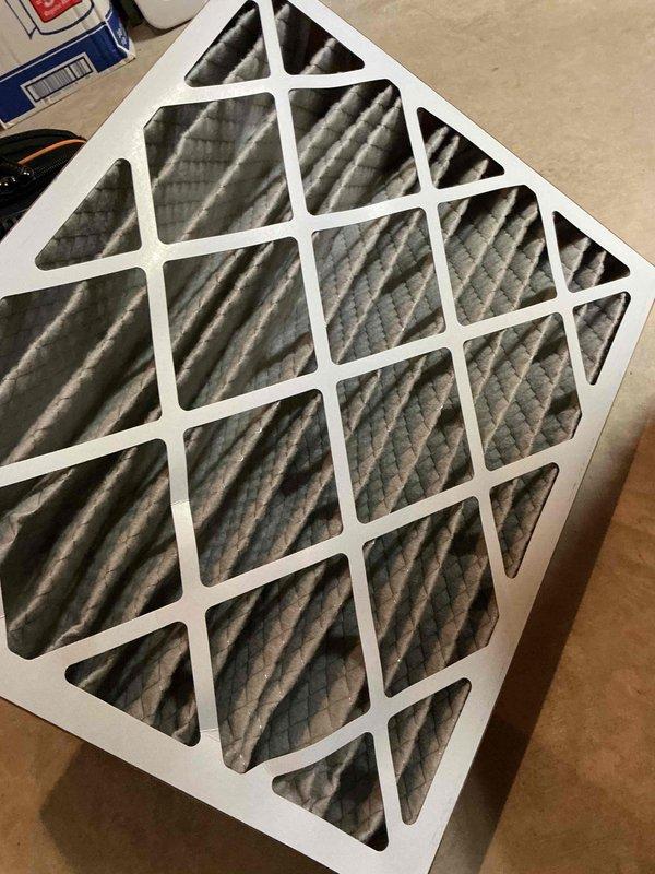 Completed comprehensive cooling system tune-up on single AC unit located in backyard. Performed standard maintenance protocol including inspection of blower wheel assembly and centrifugal fan components, which showed normal operational condition. Replaced dirty air filter with new unit, as evidenced by significant dust and debris accumulation on removed filter media. All system components inspected and found functioning within normal parameters.