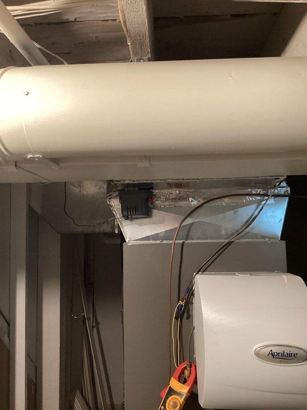 Responded to no heat call with report of furnace running but low airflow through vents. Upon arrival, confirmed system operation but inadequate air delivery throughout home. Customer had already verified filter was clean and air returns were unobstructed. Performed comprehensive diagnostic of HVAC system including inspection of air handler, blower motor assembly, and ductwork components. Tested blower motor operation and measured static pressures to identify airflow restriction. Located damper in main supply trunk that was partially closed, significantly restricting airflow to distribution system. Adjusted damper to fully open position and verified proper airflow restoration at all registers. Confirmed furnace cycling properly with adequate temperature rise across heat exchanger. System returned to normal heating operation with proper airflow throughout residence.