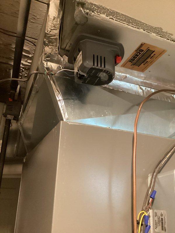 Responded to no heat call with report of furnace running but low airflow through vents. Upon arrival, confirmed system operation but inadequate air delivery throughout home. Customer had already verified filter was clean and air returns were unobstructed. Performed comprehensive diagnostic of HVAC system including inspection of air handler, blower motor assembly, and ductwork components. Tested blower motor operation and measured static pressures to identify airflow restriction. Located damper in main supply trunk that was partially closed, significantly restricting airflow to distribution system. Adjusted damper to fully open position and verified proper airflow restoration at all registers. Confirmed furnace cycling properly with adequate temperature rise across heat exchanger. System returned to normal heating operation with proper airflow throughout residence.