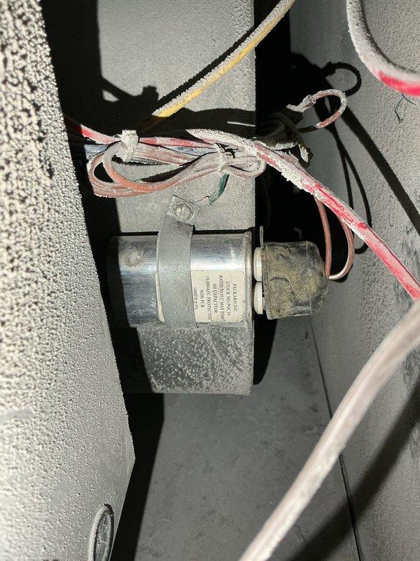 Replaced failed blower motor capacitor on PEA-3 unit with new Packard capacitor from truck stock. Verified proper electrical readings of 583 microfarads using clamp meter after installation, confirming system returned to normal operation with heating and cooling functionality restored.